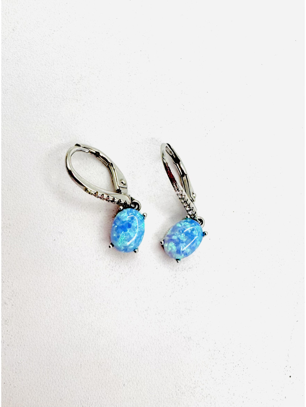 Sterling silver 4 prong created oval blue opals and cz accents leverback earring